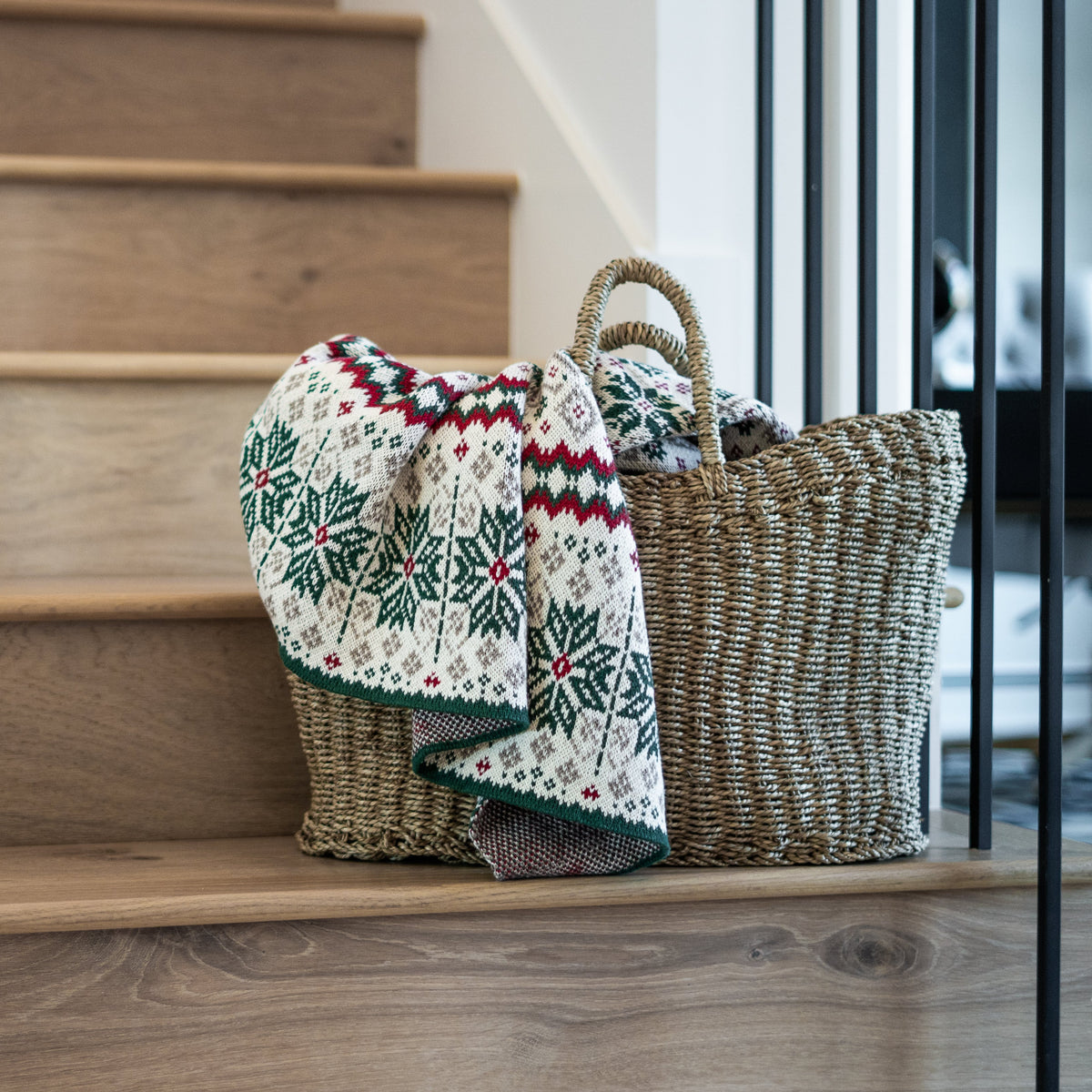 nordic inspired throw blanket in a basket on stairs
