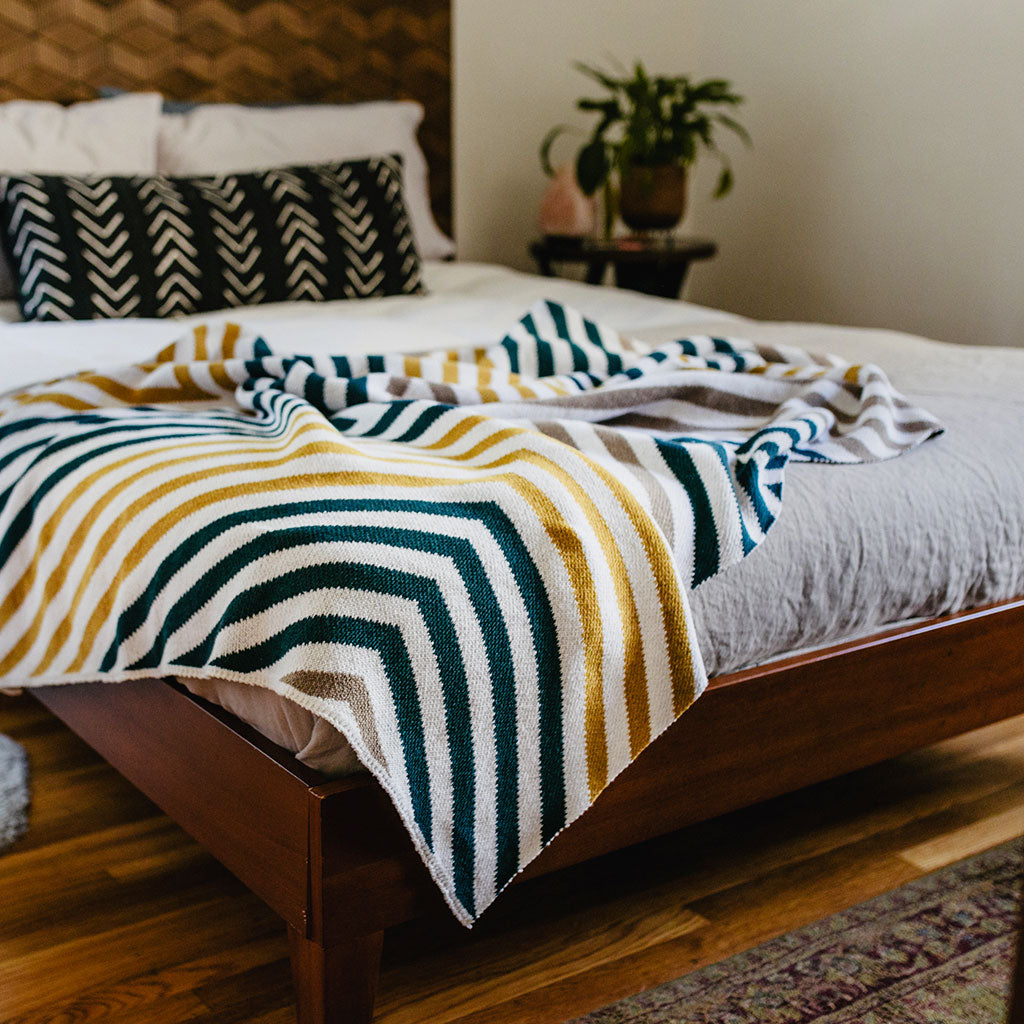 Seek and Swoon Portland Throw styled on sofa